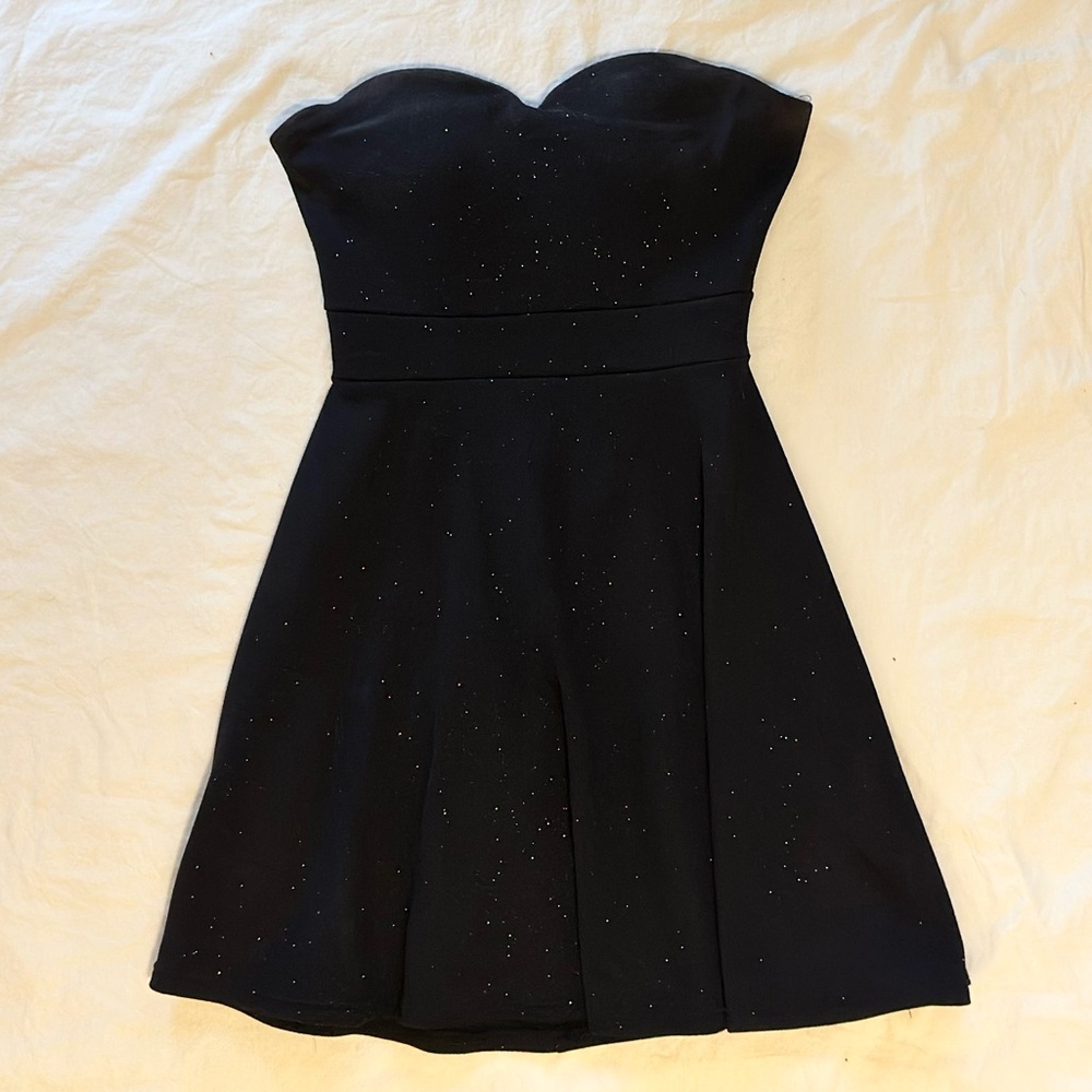 Black sweetheart neckline stappless mini dress with sparkly details